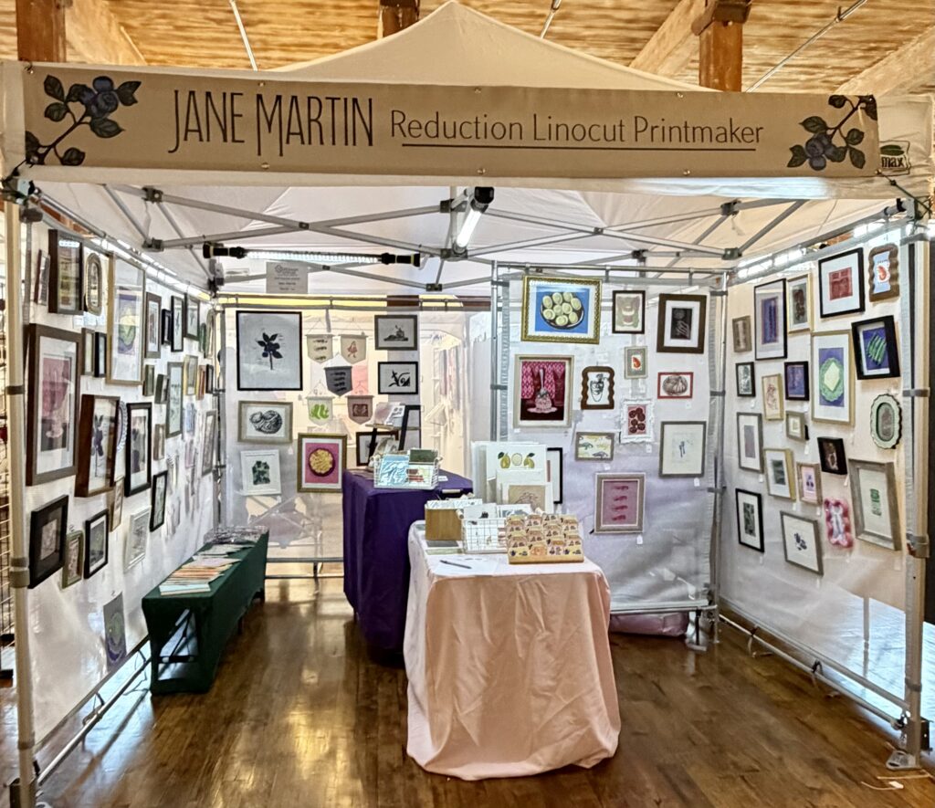 hand-carved pulled lino prints inside my printmaker vendor booth display